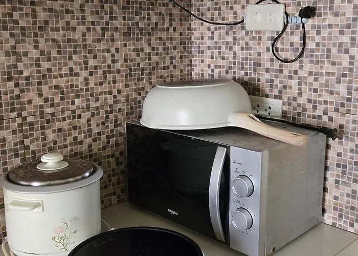 One Oasis Condominium- A Unit Apartment *